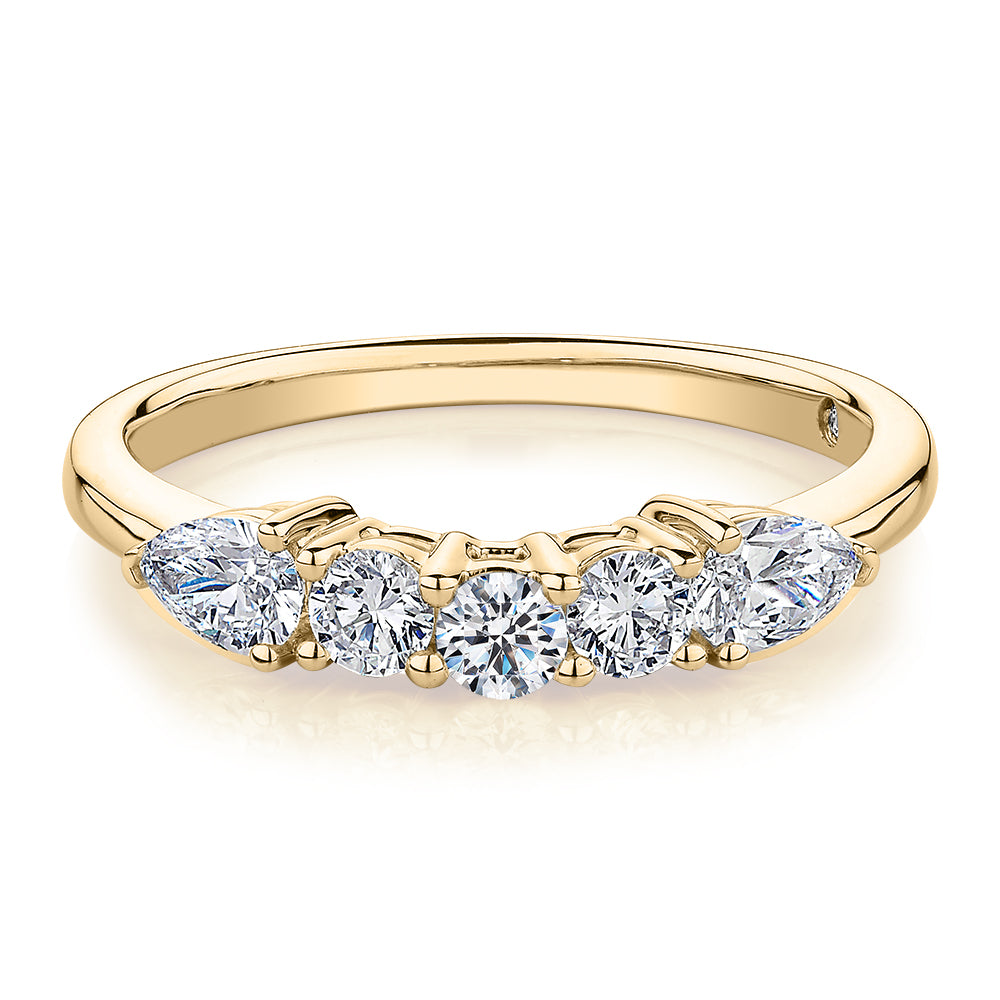 Curved wedding or eternity band with 0.83 carats* of diamond simulants in 14 carat yellow gold