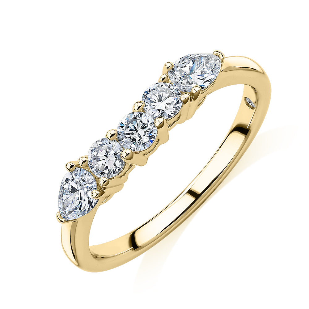 Curved wedding or eternity band with 0.83 carats* of diamond simulants in 14 carat yellow gold
