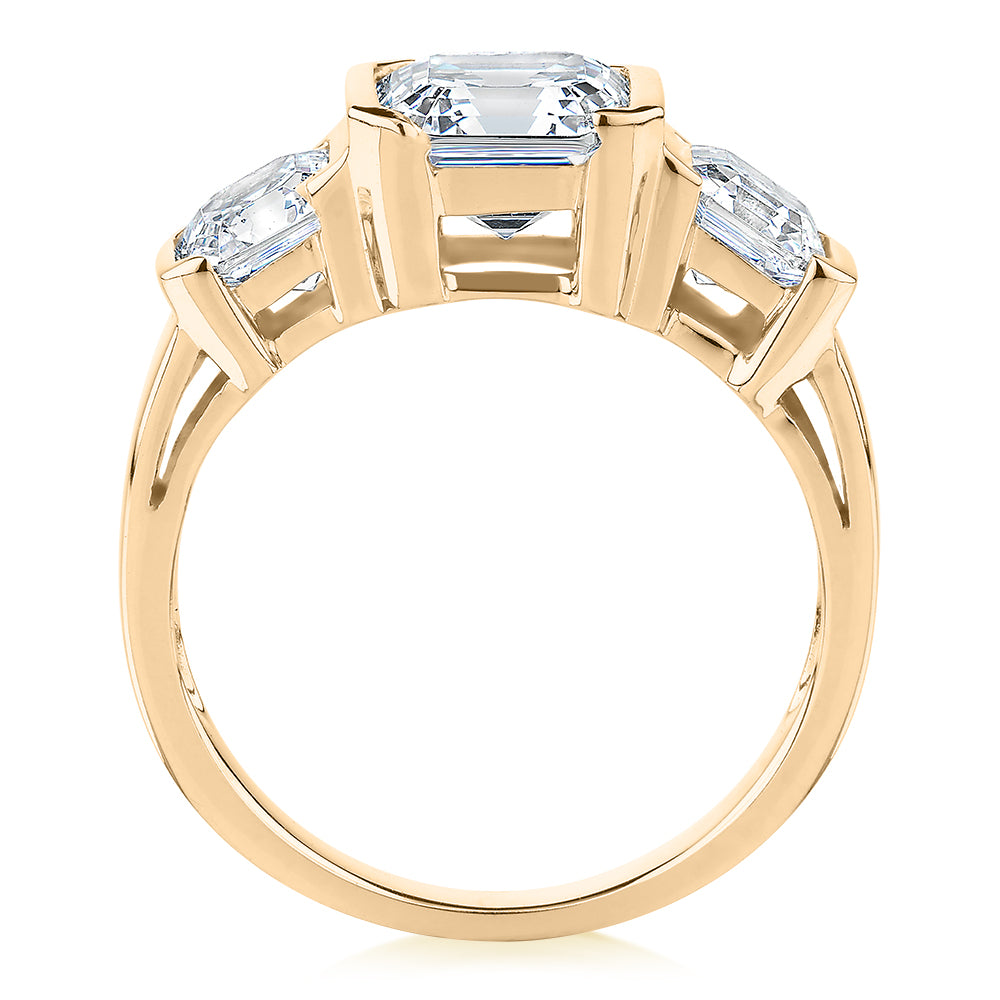 Three stone ring with 3.38 carats* of diamond simulants in 10 carat yellow gold