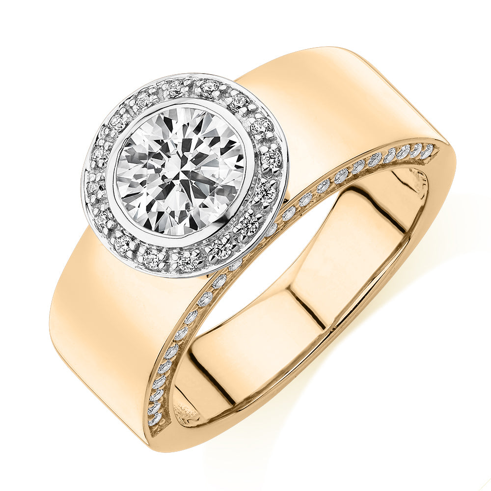 Round Brilliant halo engagement ring with 1.34 carats* of diamond simulants in 10 carat yellow and white gold