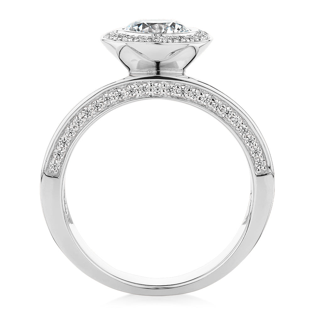 Round Brilliant halo engagement ring with 1.34 carats* of diamond simulants in 10 carat white gold