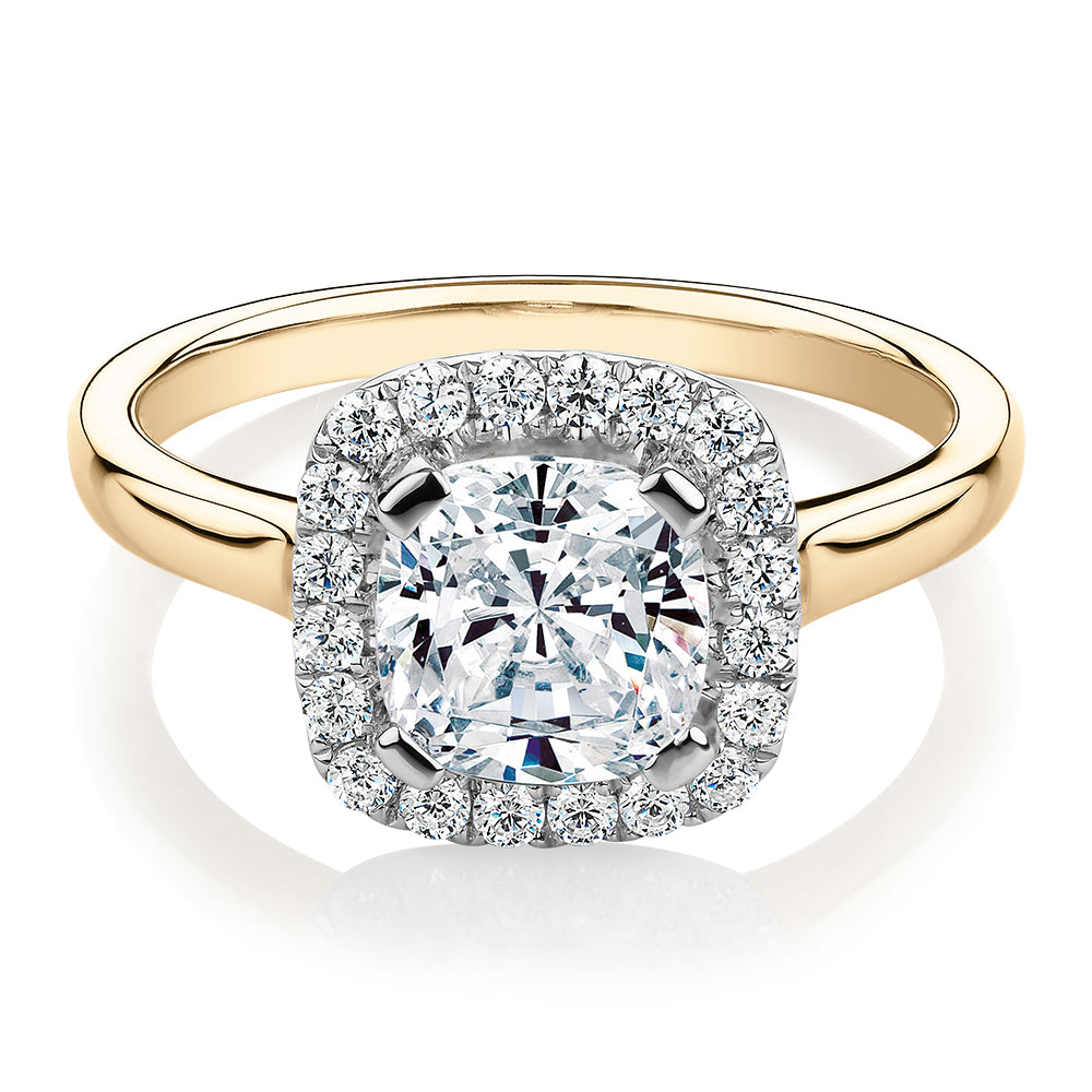 Cushion and Round Brilliant halo engagement ring with 1.58 carats* of diamond simulants in 10 carat yellow and white gold
