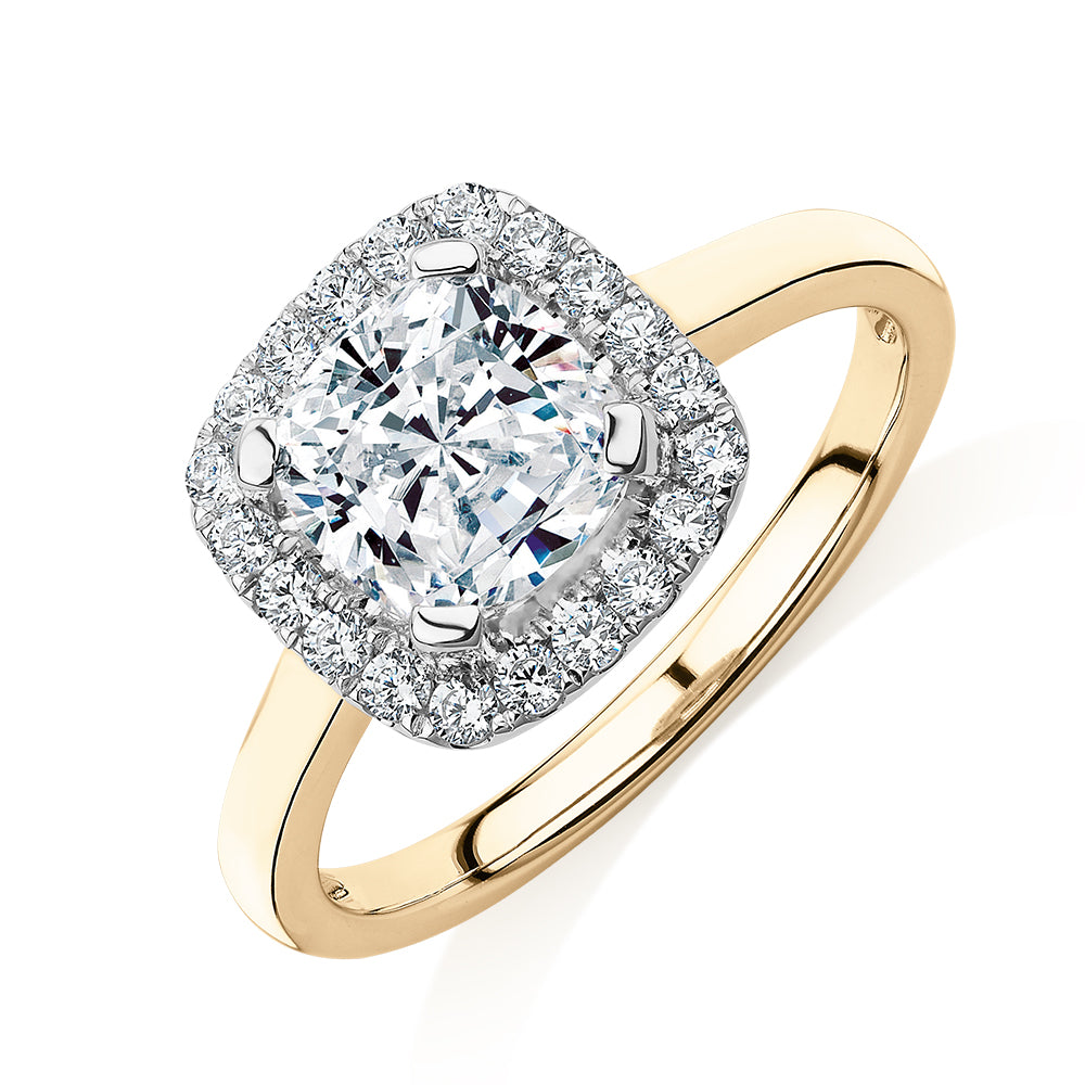 Cushion and Round Brilliant halo engagement ring with 1.58 carats* of diamond simulants in 10 carat yellow and white gold