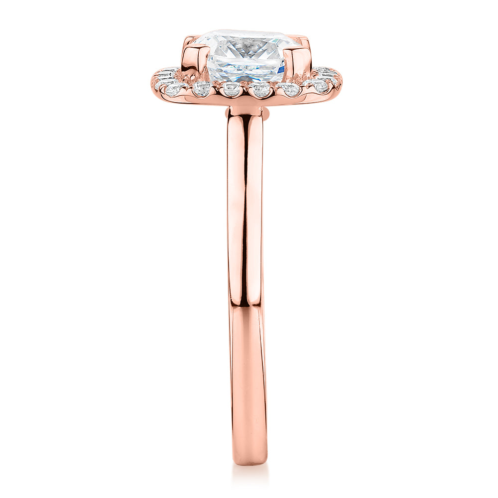 Cushion and Round Brilliant halo engagement ring with 1.58 carats* of diamond simulants in 10 carat rose gold