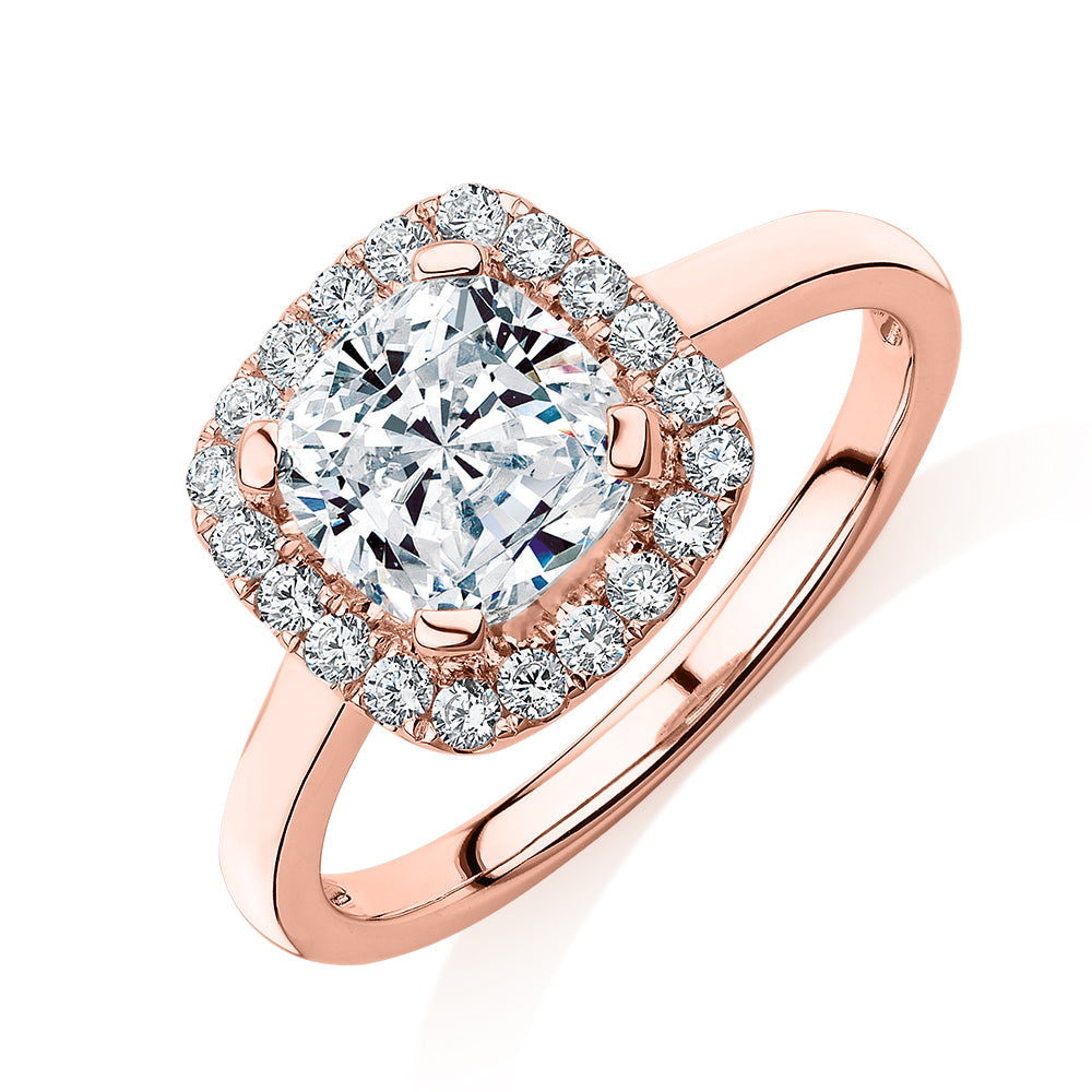 Cushion and Round Brilliant halo engagement ring with 1.58 carats* of diamond simulants in 10 carat rose gold