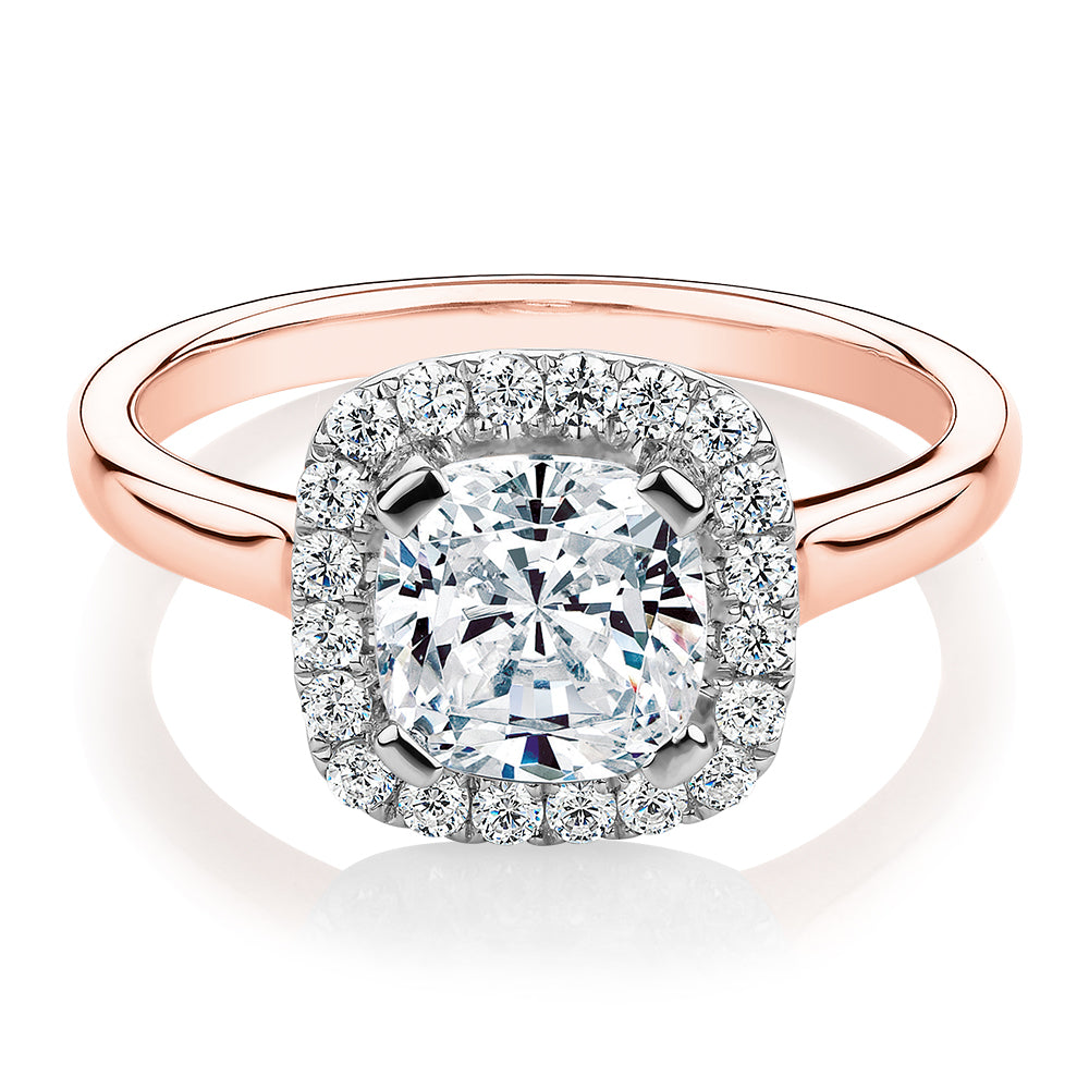 Cushion and Round Brilliant halo engagement ring with 1.58 carats* of diamond simulants in 10 carat rose and white gold
