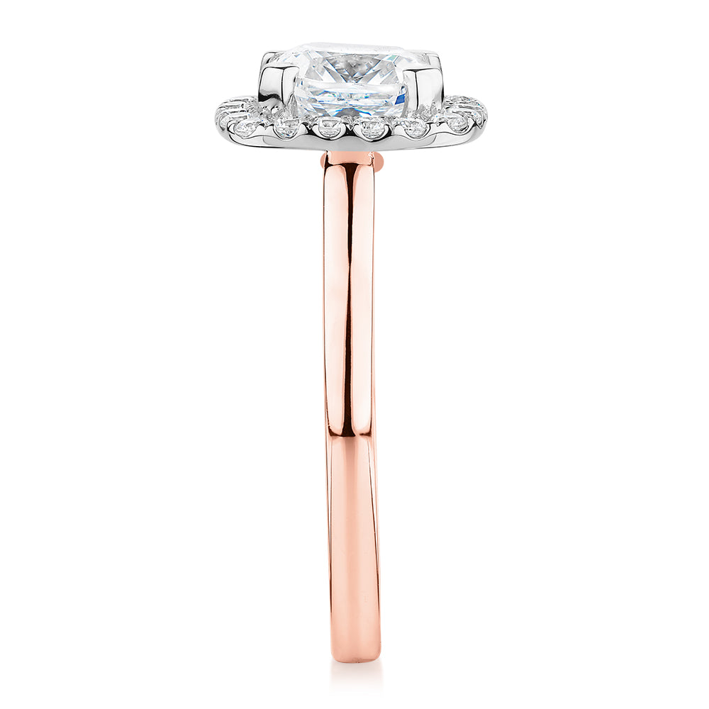 Cushion and Round Brilliant halo engagement ring with 1.58 carats* of diamond simulants in 10 carat rose and white gold