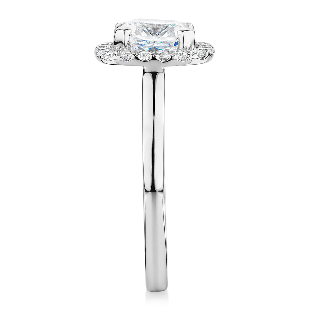 Cushion and Round Brilliant halo engagement ring with 1.58 carats* of diamond simulants in 10 carat white gold