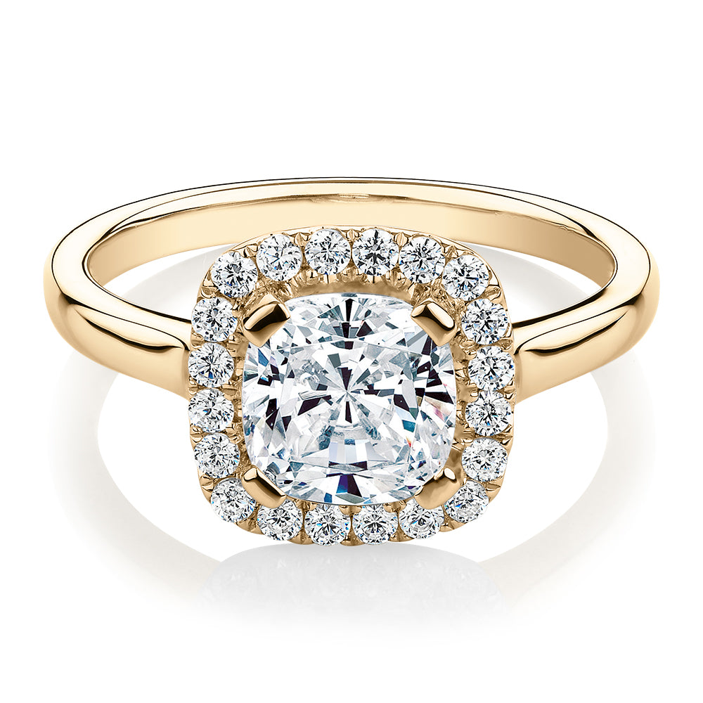 Cushion and Round Brilliant halo engagement ring with 1.58 carats* of diamond simulants in 10 carat yellow gold