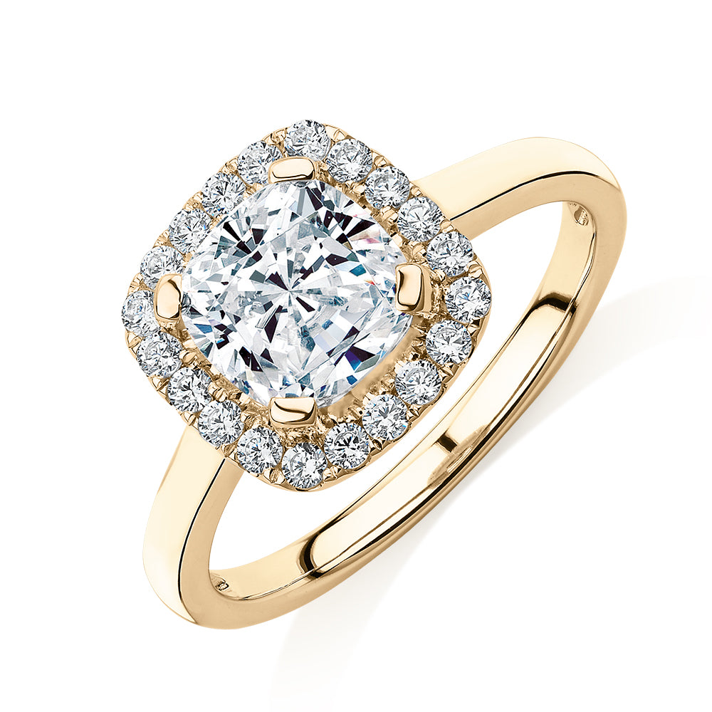 Cushion and Round Brilliant halo engagement ring with 1.58 carats* of diamond simulants in 10 carat yellow gold
