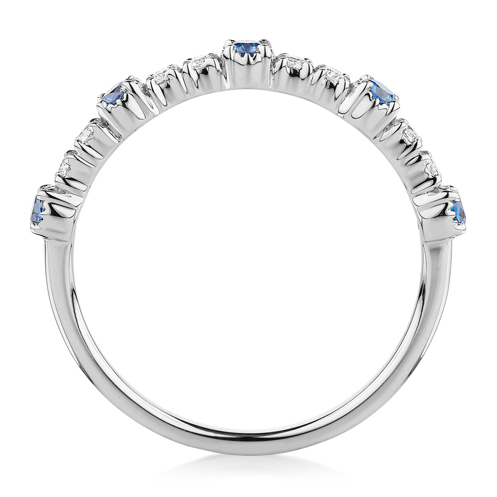 Wedding or eternity band with blue topaz and diamond simulants in 10 carat white gold