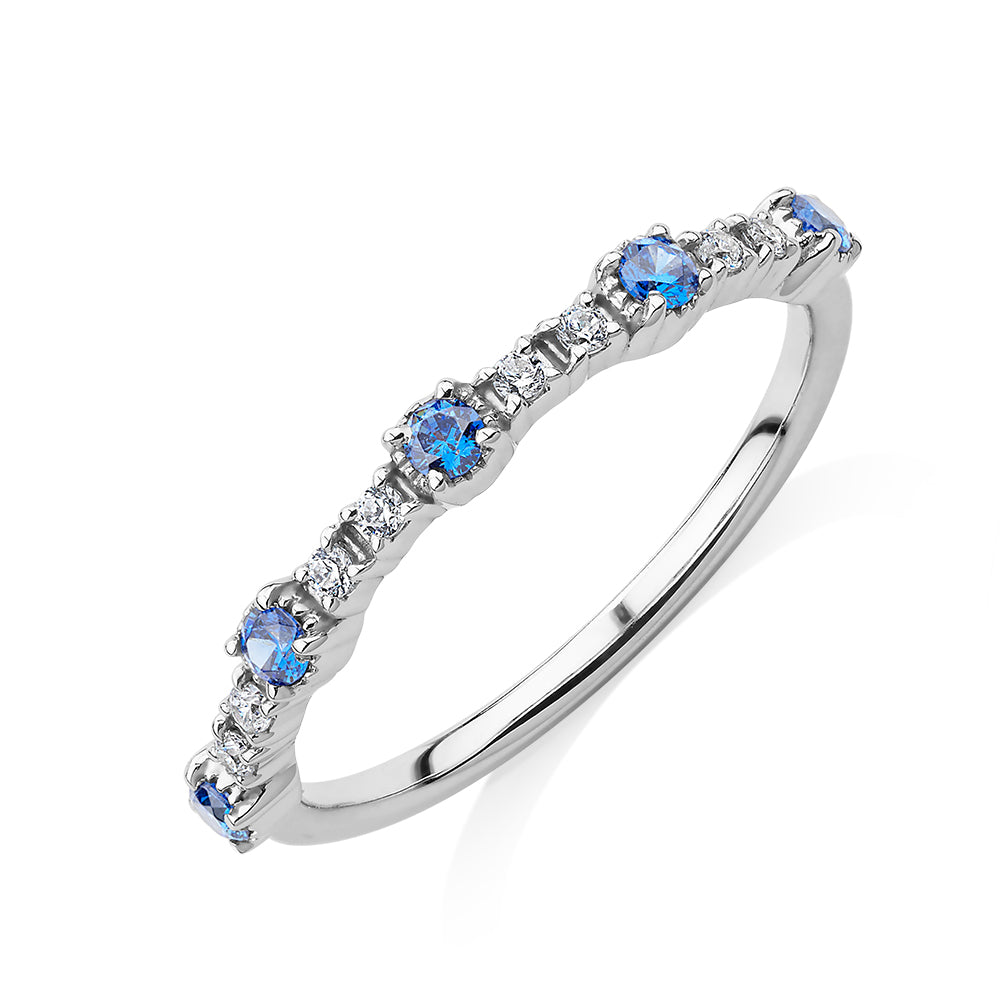 Wedding or eternity band with blue topaz and diamond simulants in 10 carat white gold