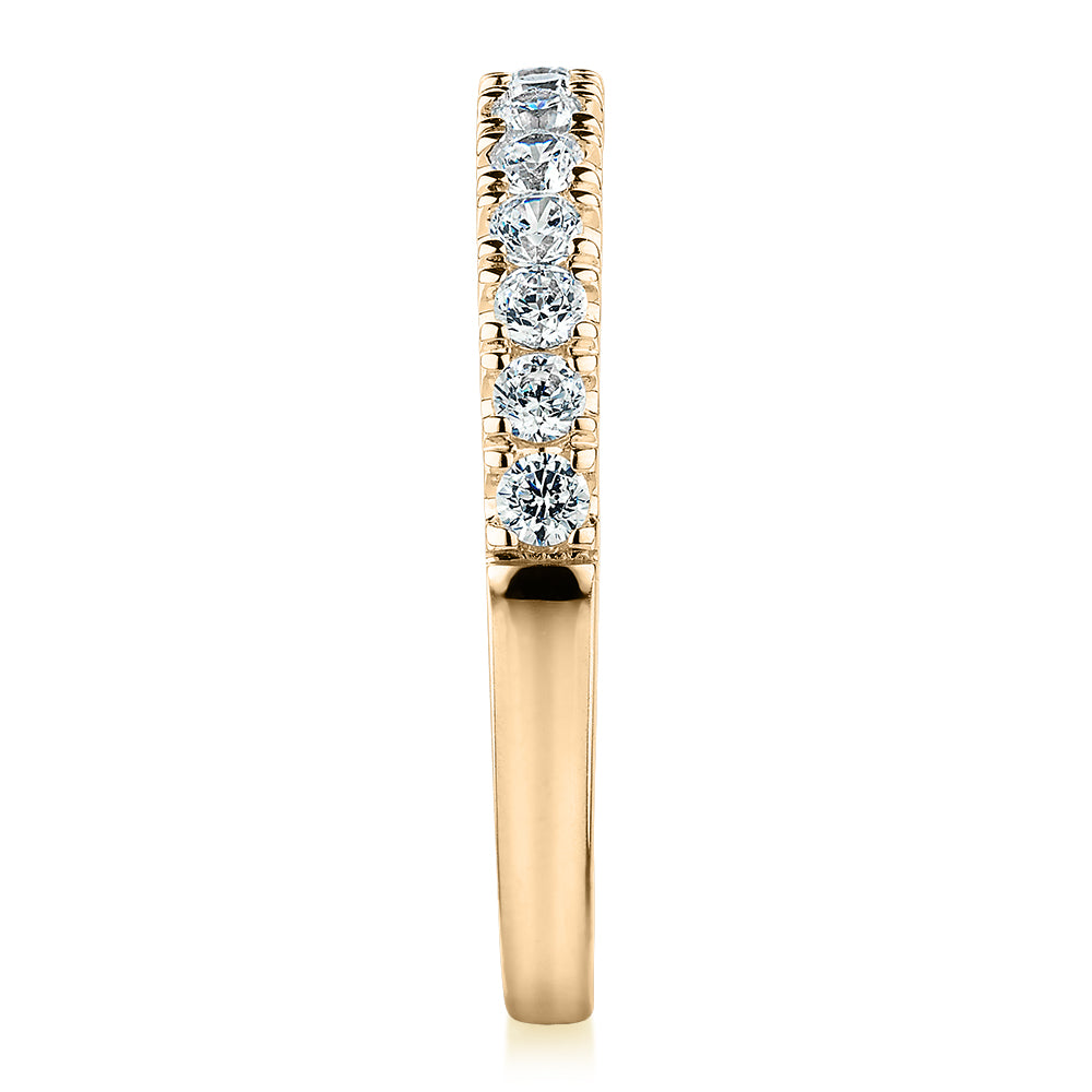 Wedding or eternity band with 0.39 carats* of diamond simulants in 10 carat yellow gold