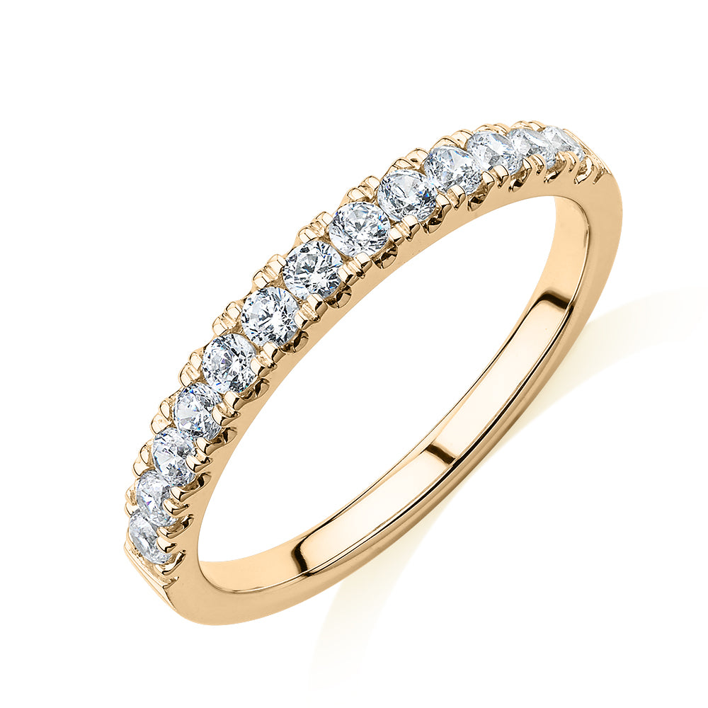 Wedding or eternity band with 0.39 carats* of diamond simulants in 10 carat yellow gold