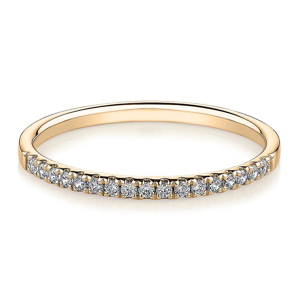 Wedding or eternity band in 14 carat yellow gold