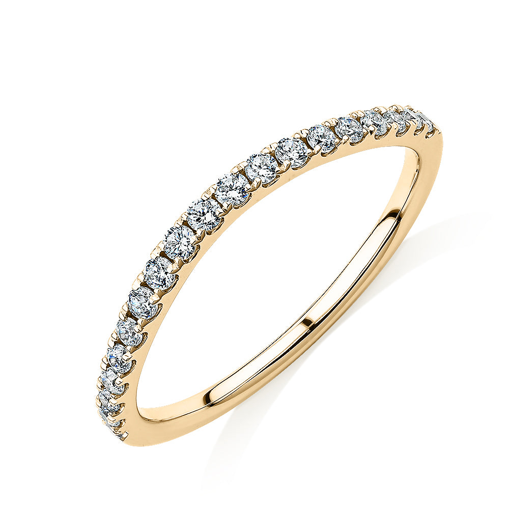 Curved wedding or eternity band with 0.25 carats* of diamond simulants in 10 carat yellow gold