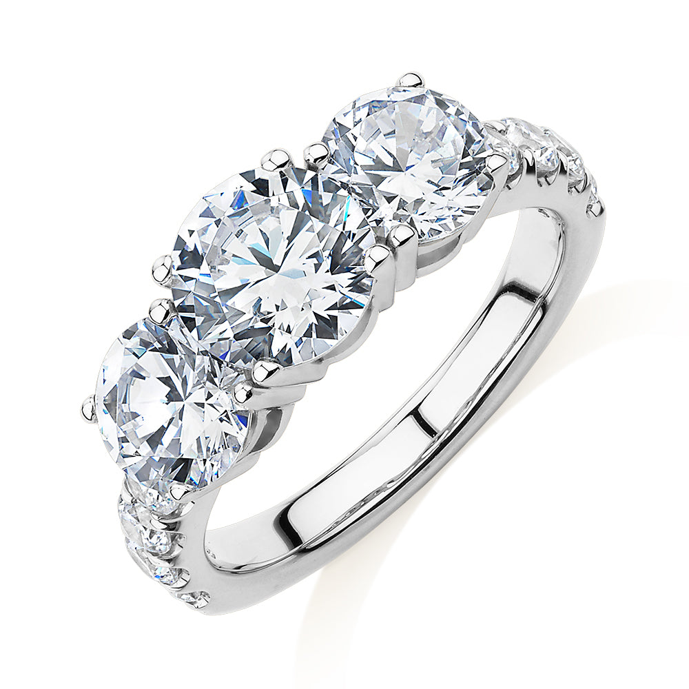 Three stone ring with 3.44 carats* of diamond simulants in 10 carat white gold