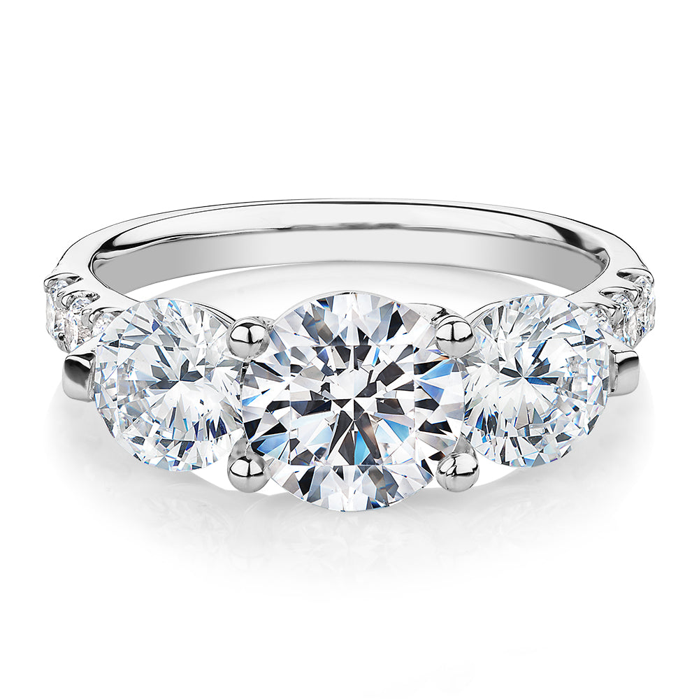 Three stone ring with 3.59 carats* of diamond simulants in 10 carat white gold