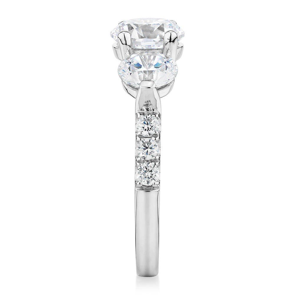 Three stone ring with 3.59 carats* of diamond simulants in 10 carat white gold