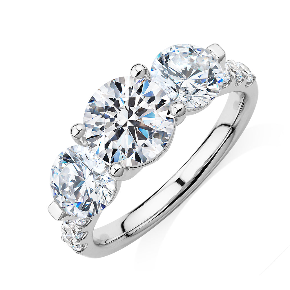 Three stone ring with 3.59 carats* of diamond simulants in 10 carat white gold