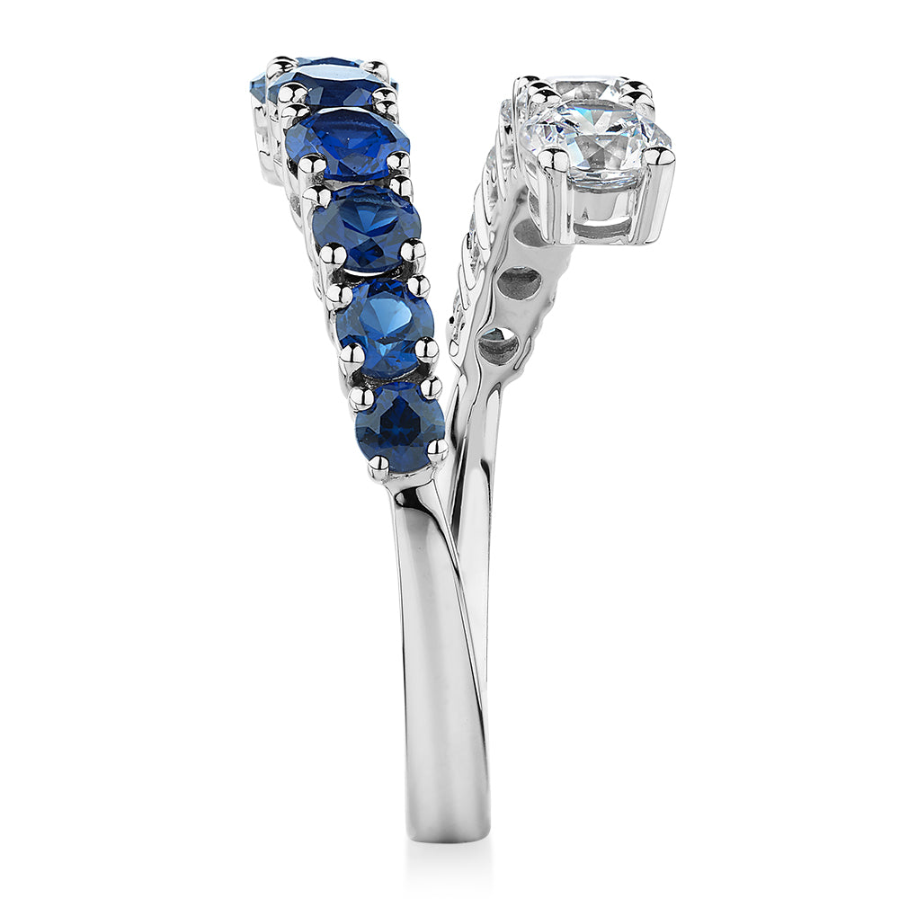Dress ring with sapphire simulants and 0.91 carats* of diamond simulants in 10 carat white gold