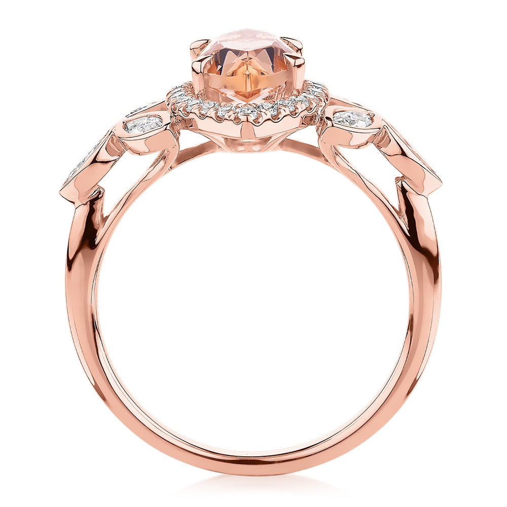 Marquise and Round Brilliant halo engagement ring with morganite simulant and 0.84 carats* of diamond simulants in 10 carat rose gold