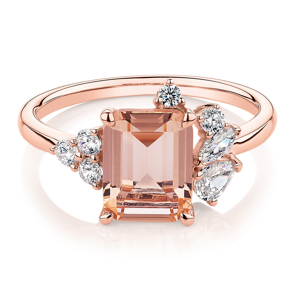 Emerald Cut and Round Brilliant shouldered engagement ring with morganite simulant and 0.45 carats* of diamond simulants in 10 carat rose gold