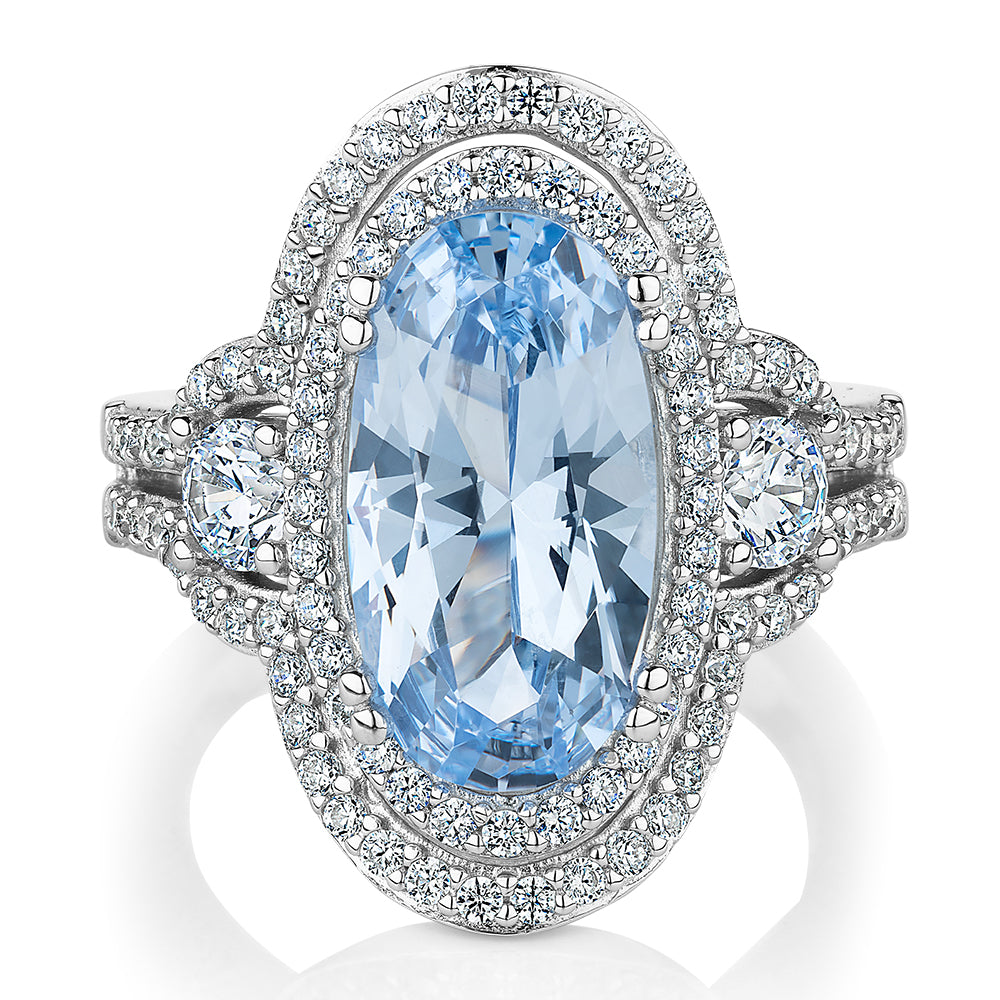 Dress ring with blue topaz simulant and 1.42 carats* of diamond simulants in sterling silver