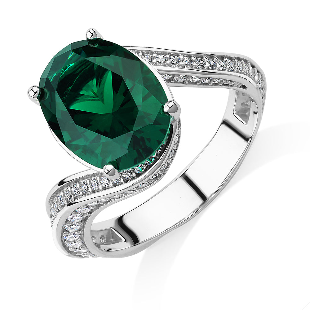 Dress ring with emerald simulant and 0.82 carats* of diamond simulants in sterling silver