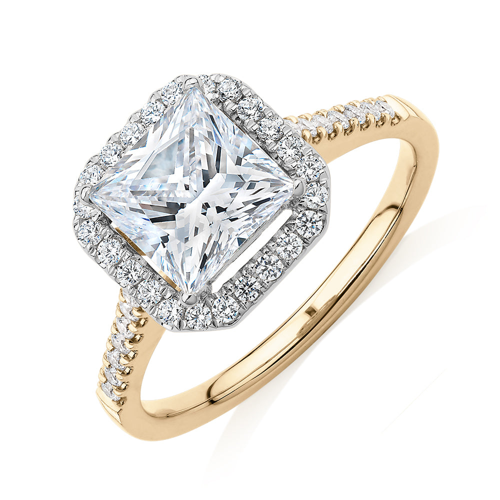 Princess Cut and Round Brilliant halo engagement ring with 2.21 carats* of diamond simulants in 14 carat yellow and white gold