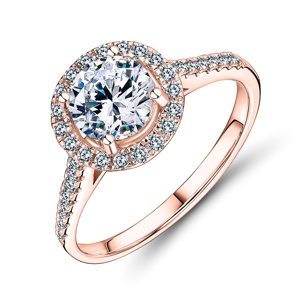 Round Brilliant halo engagement ring with 1.25 carats* of diamond simulants in 14 carat rose gold