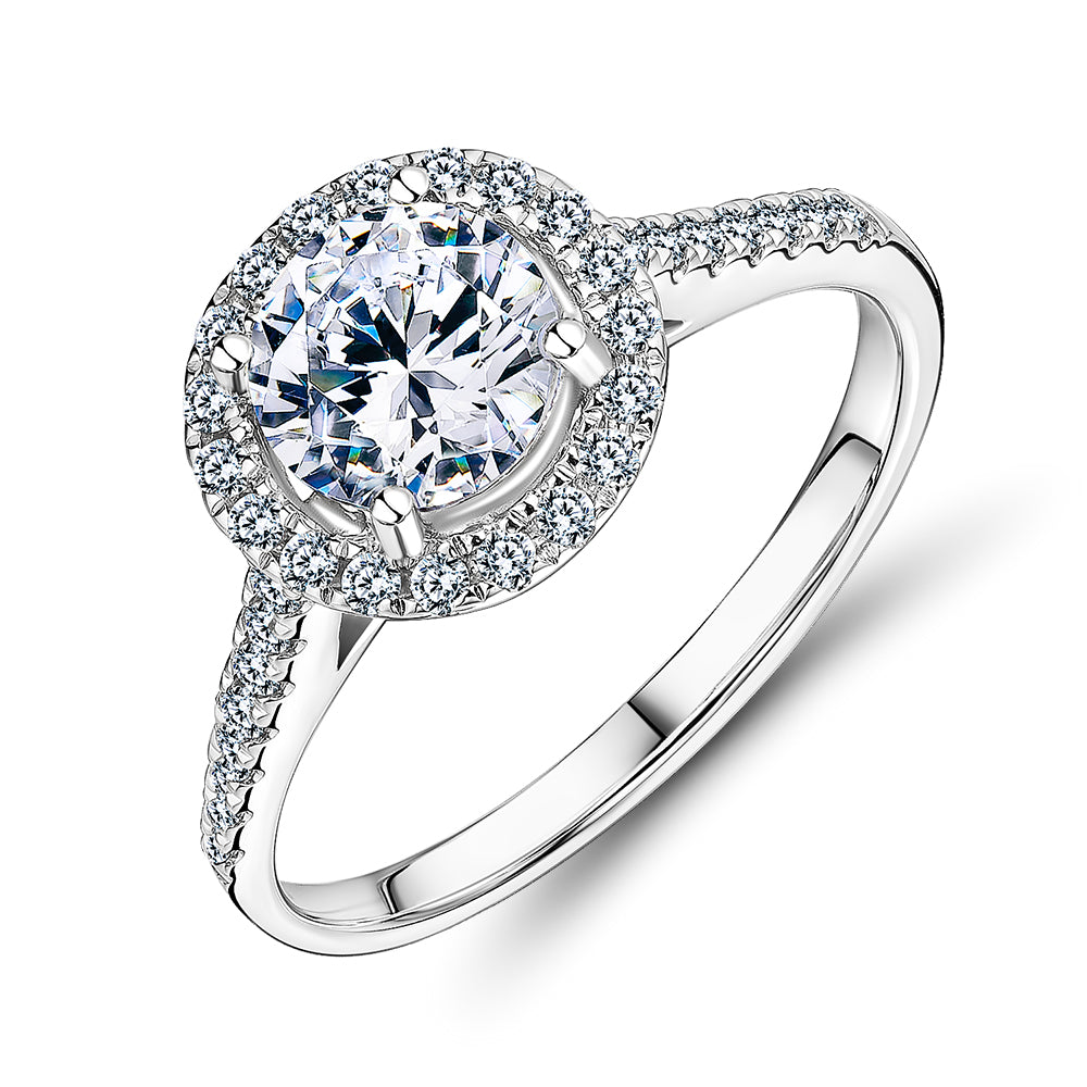 Round Brilliant halo engagement ring with 1.25 carats* of diamond simulants in 14 carat white gold