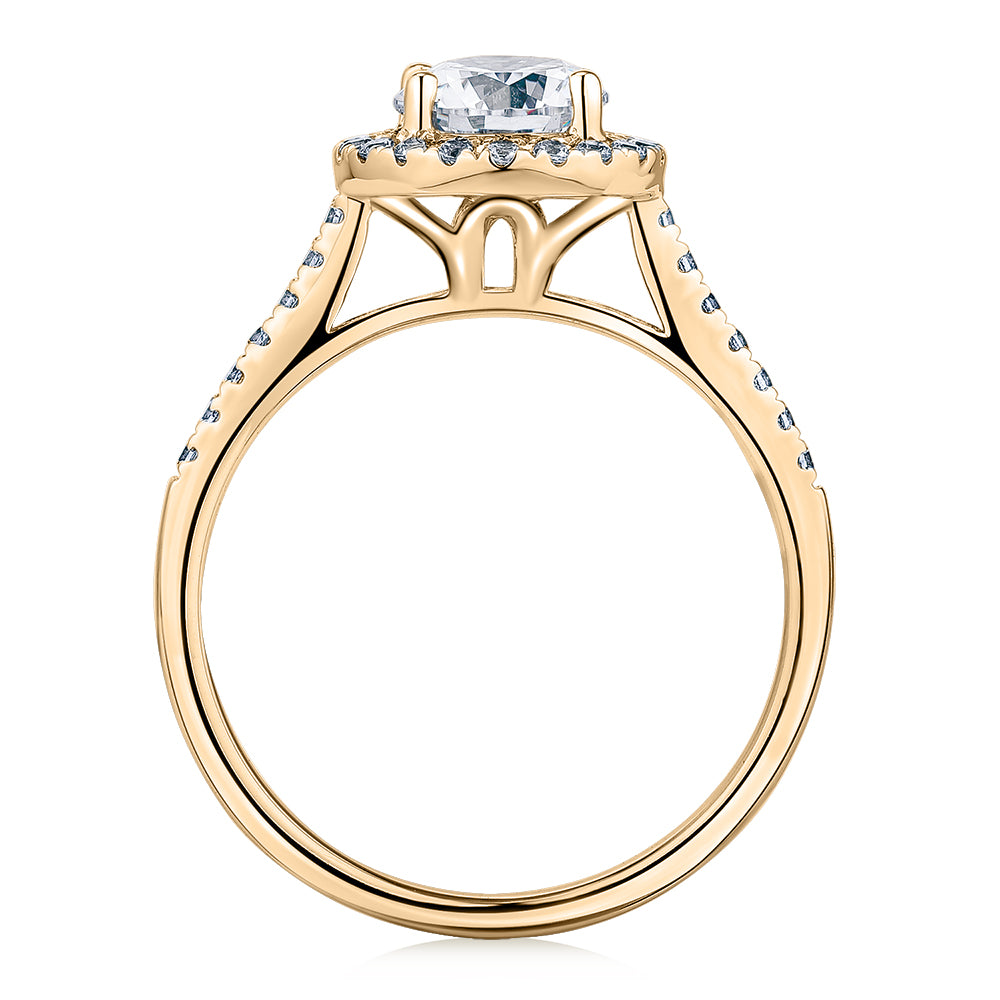 Round Brilliant halo engagement ring with 1.25 carats* of diamond simulants in 14 carat yellow gold