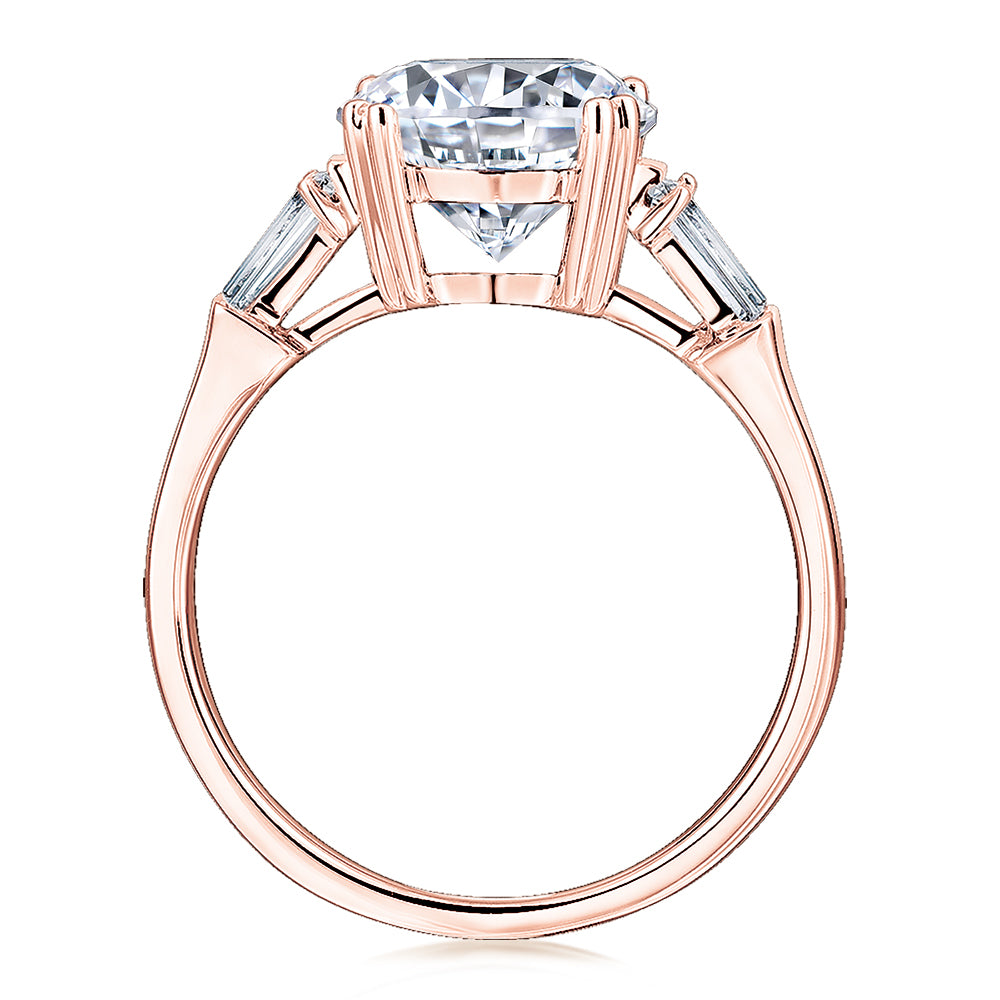 Round Brilliant and Baguette shouldered engagement ring with 3.17 carats* of diamond simulants in 10 carat rose gold