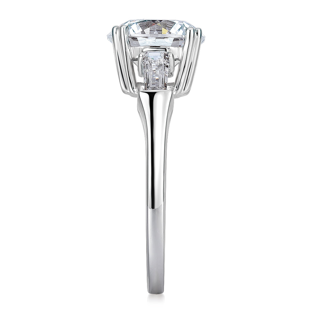 Round Brilliant and Baguette shouldered engagement ring with 3.17 carats* of diamond simulants in 10 carat white gold