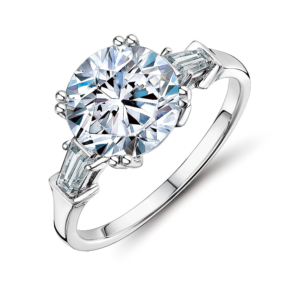 Round Brilliant and Baguette shouldered engagement ring with 3.17 carats* of diamond simulants in 10 carat white gold