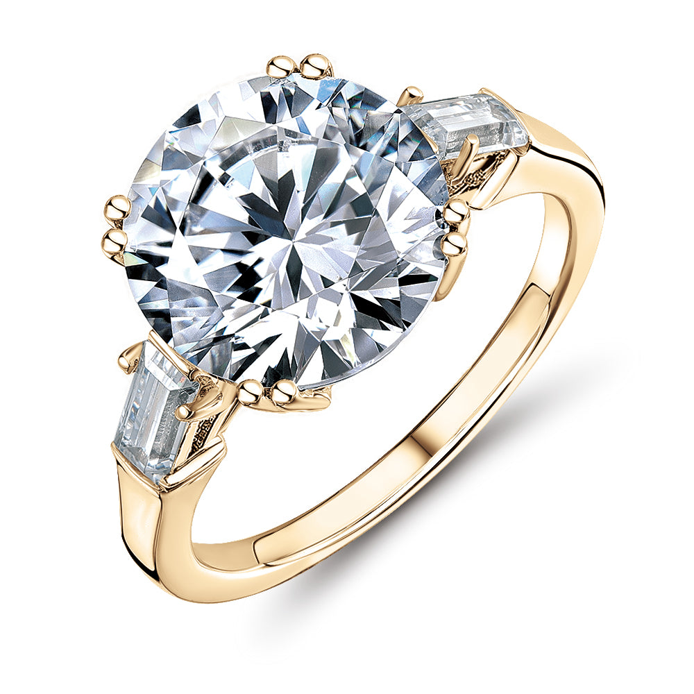 Round Brilliant and Baguette shouldered engagement ring with 5.33 carats* of diamond simulants in 10 carat yellow gold