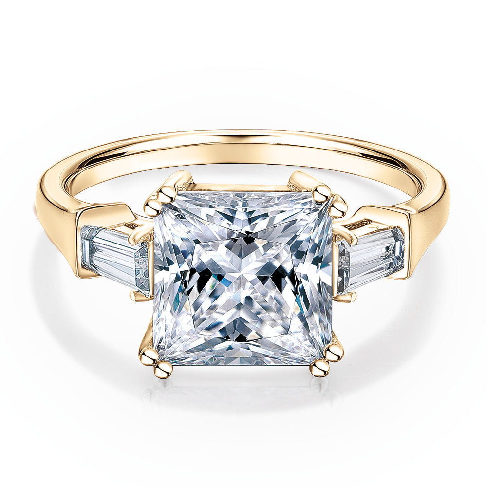 Princess Cut and Baguette shouldered engagement ring with 3.43 carats* of diamond simulants in 10 carat yellow gold