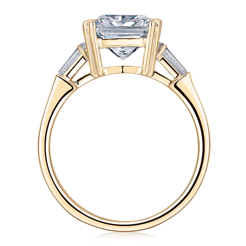Princess Cut and Baguette shouldered engagement ring with 3.43 carats* of diamond simulants in 10 carat yellow gold