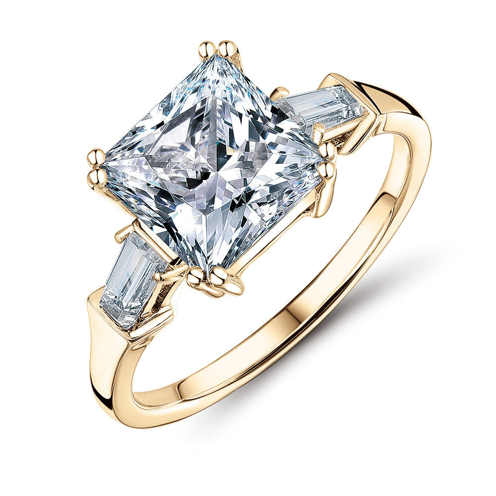 Princess Cut and Baguette shouldered engagement ring with 3.43 carats* of diamond simulants in 10 carat yellow gold