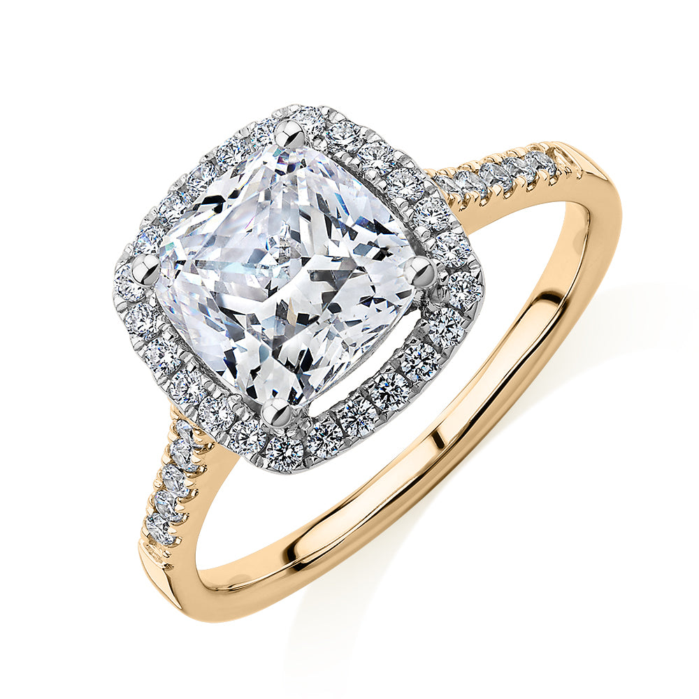 Cushion and Round Brilliant halo engagement ring with 1.91 carats* of diamond simulants in 14 carat yellow and white gold