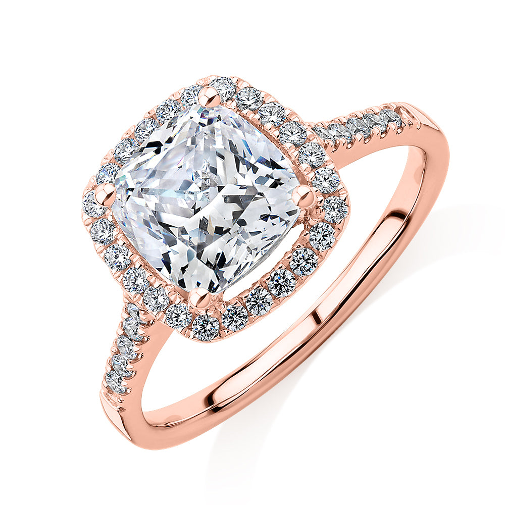 Cushion and Round Brilliant halo engagement ring with 1.91 carats* of diamond simulants in 14 carat rose gold