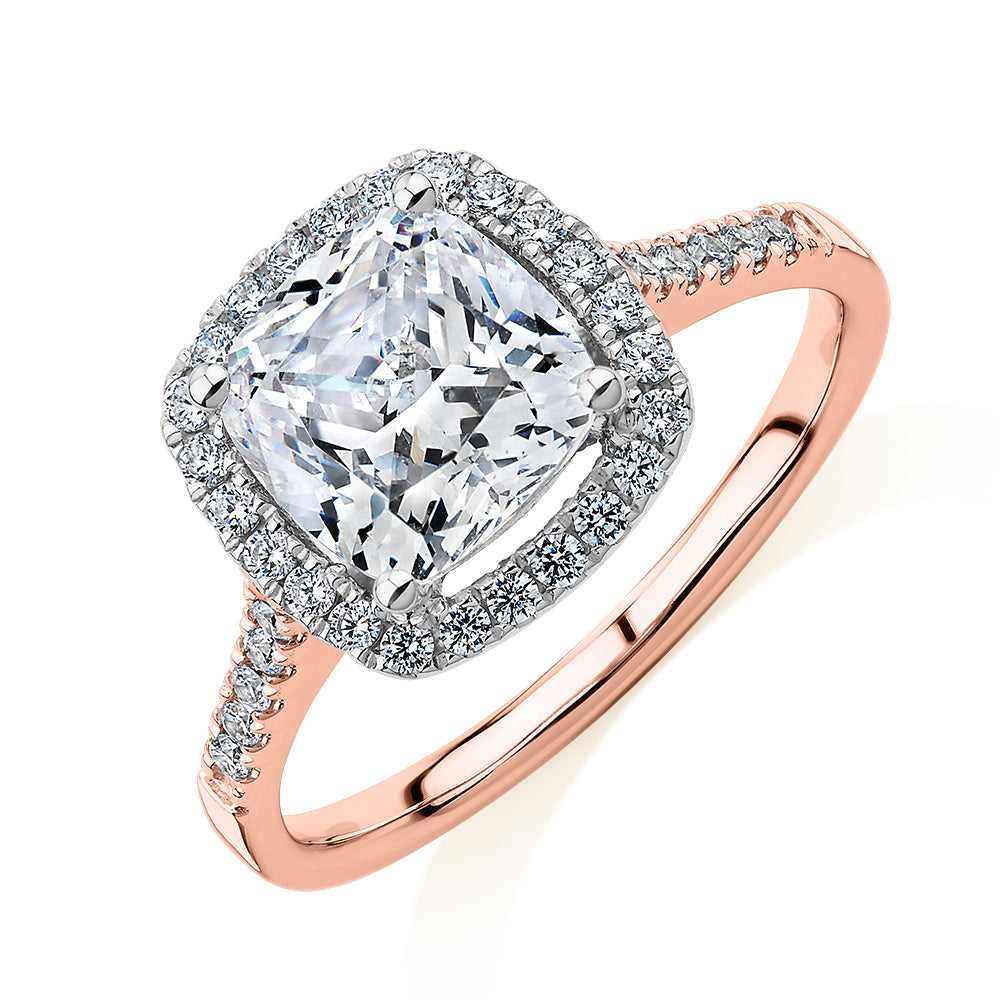 Cushion and Round Brilliant halo engagement ring with 1.91 carats* of diamond simulants in 14 carat rose and white gold
