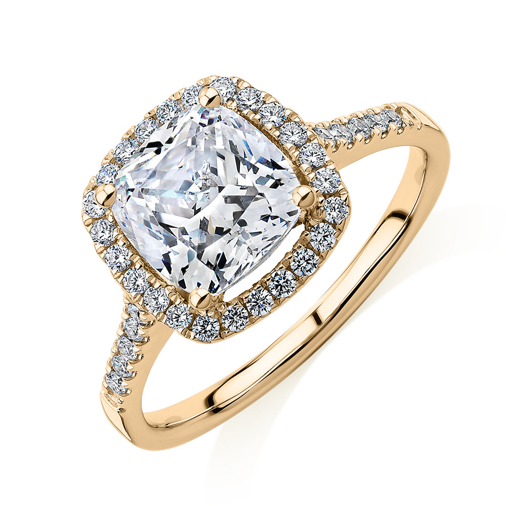 Cushion and Round Brilliant halo engagement ring with 1.91 carats* of diamond simulants in 14 carat yellow gold