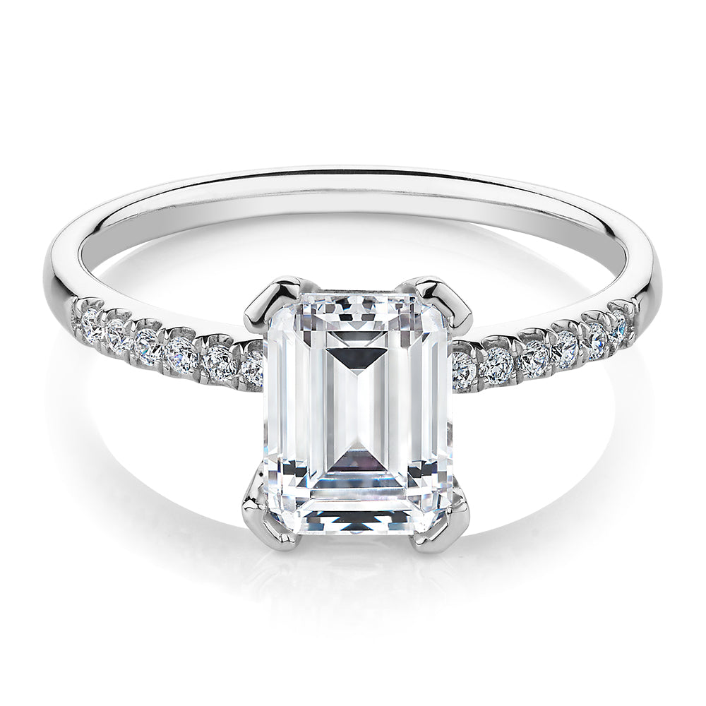 Emerald Cut and Round Brilliant shouldered engagement ring with 1.82 carats* of diamond simulants in 14 carat white gold