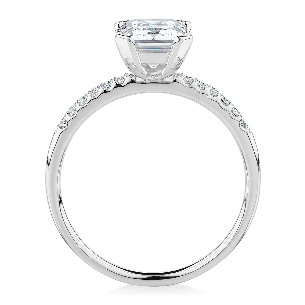 Emerald Cut and Round Brilliant shouldered engagement ring with 1.82 carats* of diamond simulants in 14 carat white gold