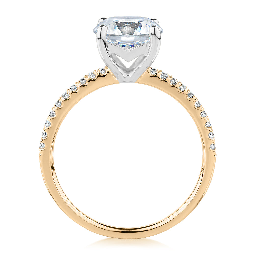 Round Brilliant shouldered engagement ring with 2.17 carats* of diamond simulants in 14 carat yellow and white gold