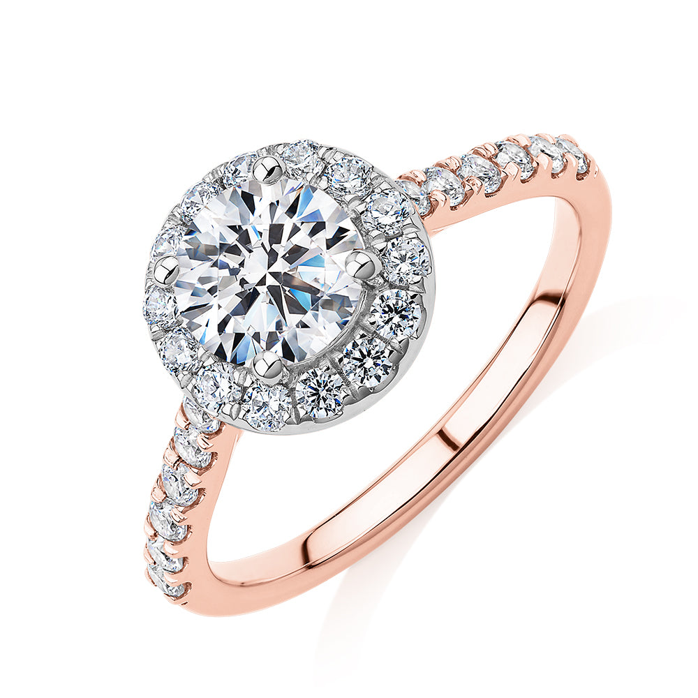 Round Brilliant halo engagement ring with 1.61 carats* of diamond simulants in 14 carat rose and white gold