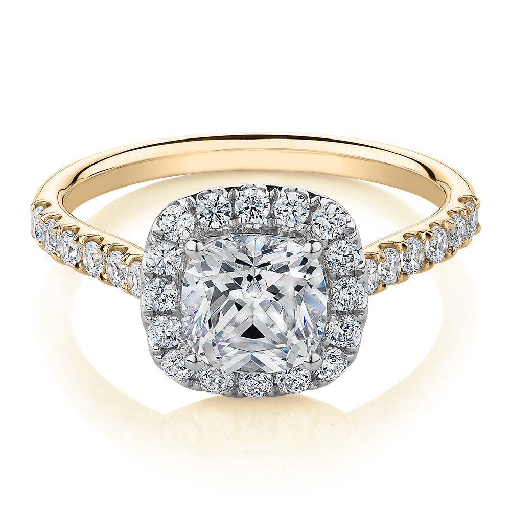 Cushion and Round Brilliant halo engagement ring with 1.65 carats* of diamond simulants in 14 carat yellow and white gold