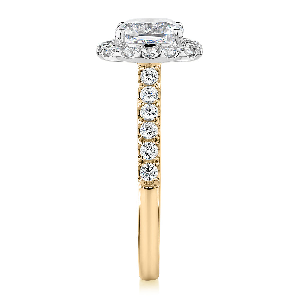 Cushion and Round Brilliant halo engagement ring with 1.65 carats* of diamond simulants in 14 carat yellow and white gold